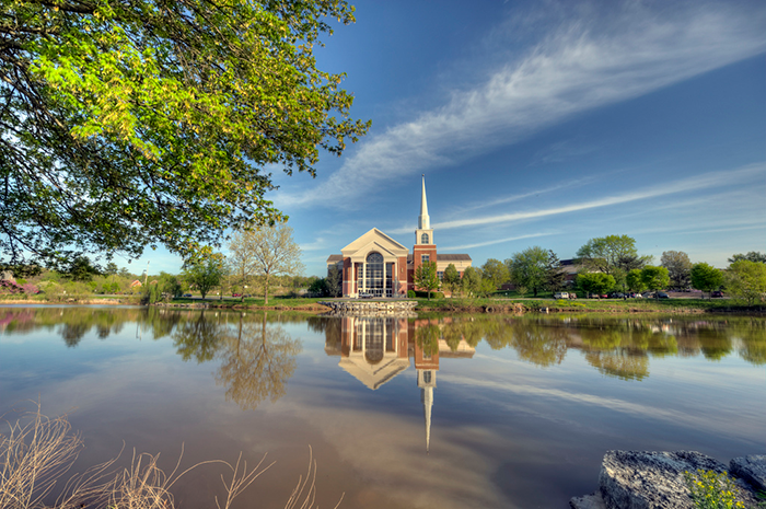 church with a reflection on a lake